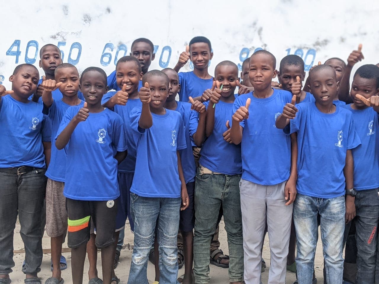 Amosi Schools students smiling and showing confidence
